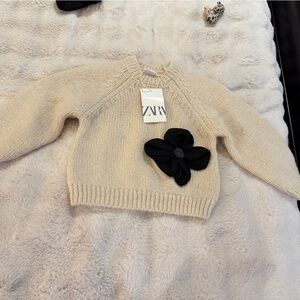 Zara Cream Turtleneck Sweater with Black Flower Accent
